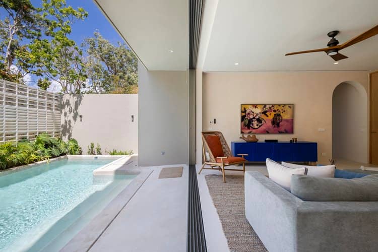 Indoor-outdoor pool view representing the cenote-style swims around Tulum
