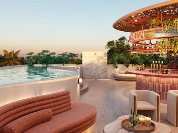 Rooftop bar and pool of a condo near Aldea Zama dining