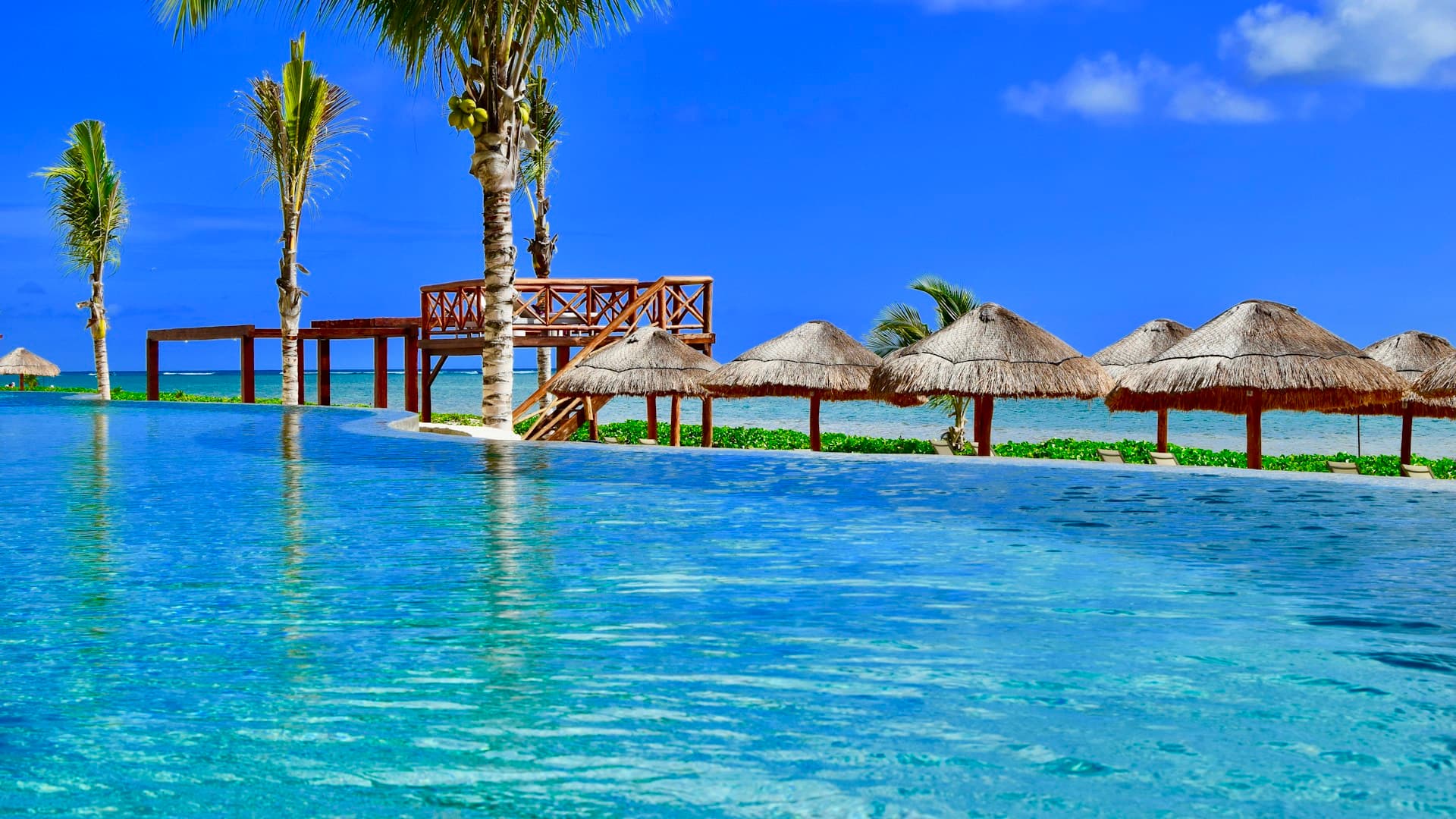 Wooden huts overlooking the Caribbean waterfront in Puerto Morelos, Mexico